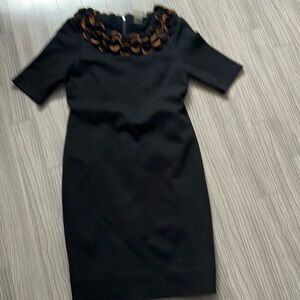 little black dress with flower scoop collar